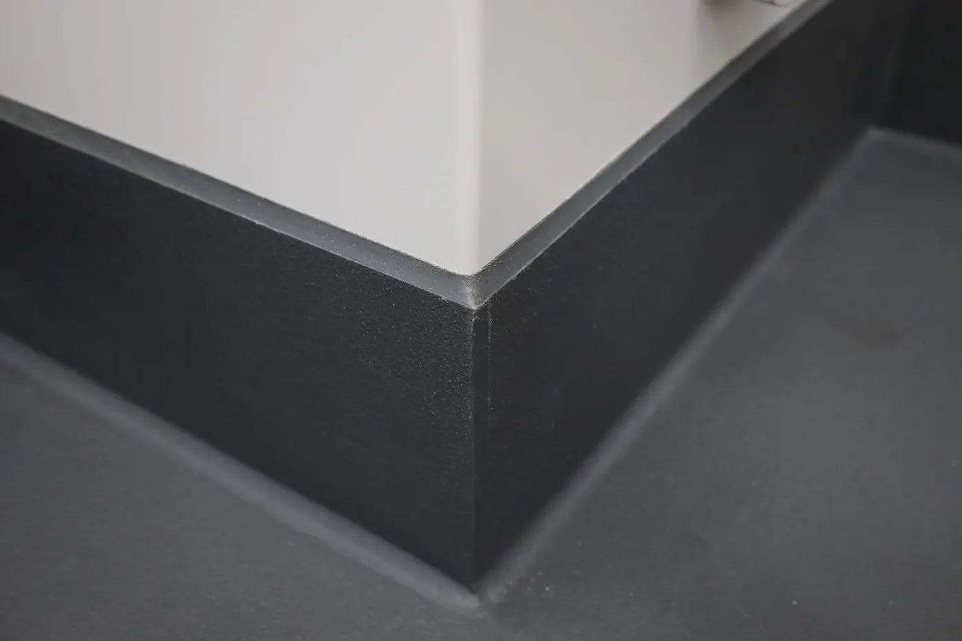 Eco-Grip integral cove base turning up the wall